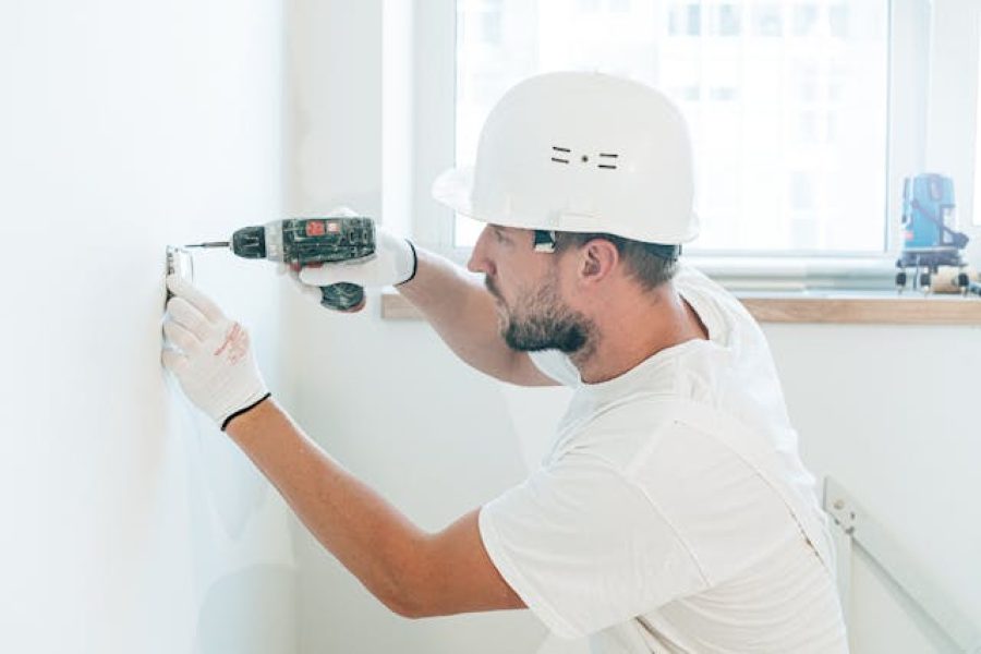 A contractor using a drill