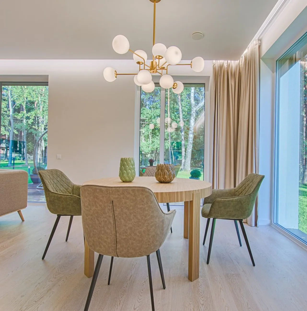 dining_area A dining room with large windows and statement lighting fixture