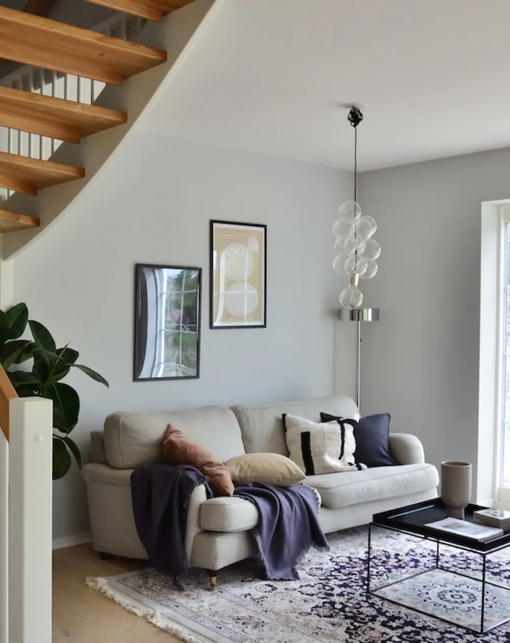 A small living room off of a winding staircase