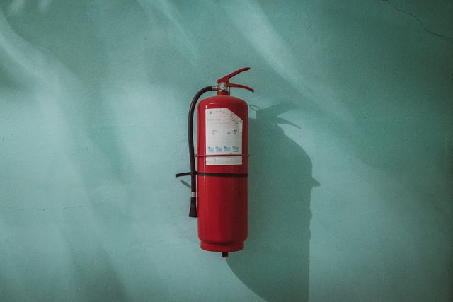 a fire extinguisher against a blue background