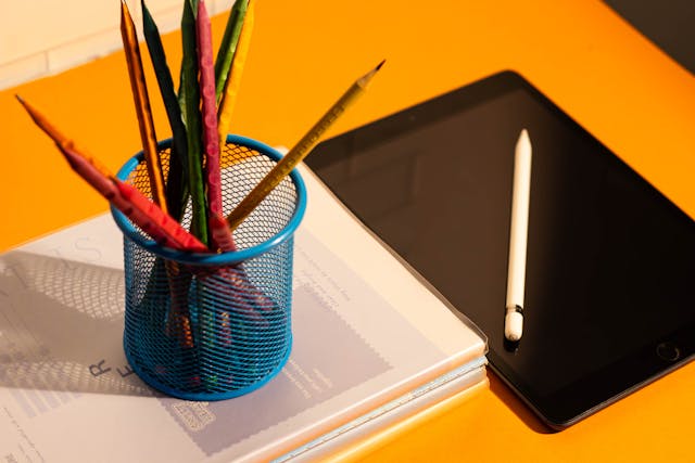 pencils and an ipad in a classroom