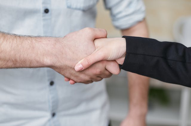 two people shaking hands
