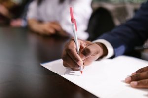 business-person-writing-on-paper