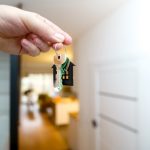 person holding house keys