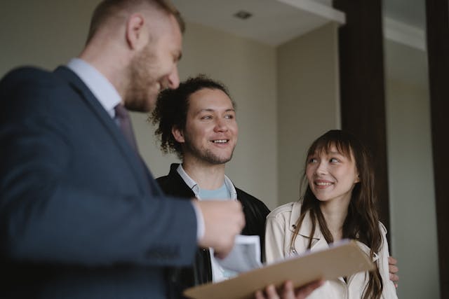 a landlord speaking with two tenants