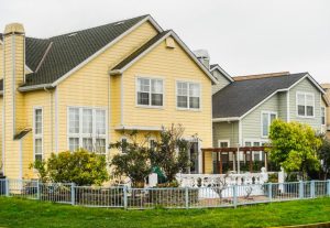 suburban houses with gardens and fences