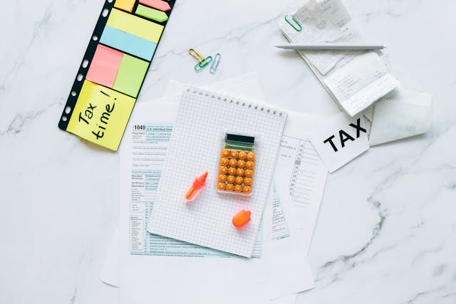 tax documents and a calculator